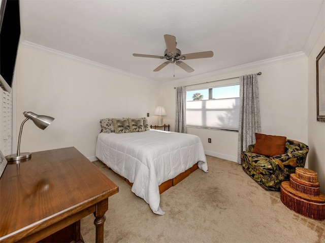 carpeted bedroom featuring ceiling fan and ornamental molding