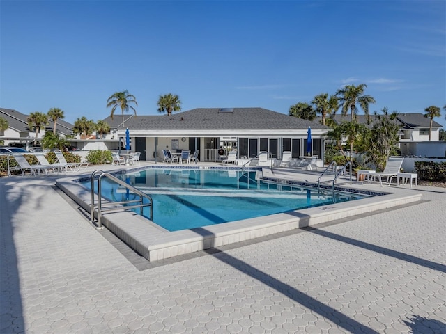 view of swimming pool with a patio