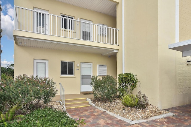 entrance to property with a balcony