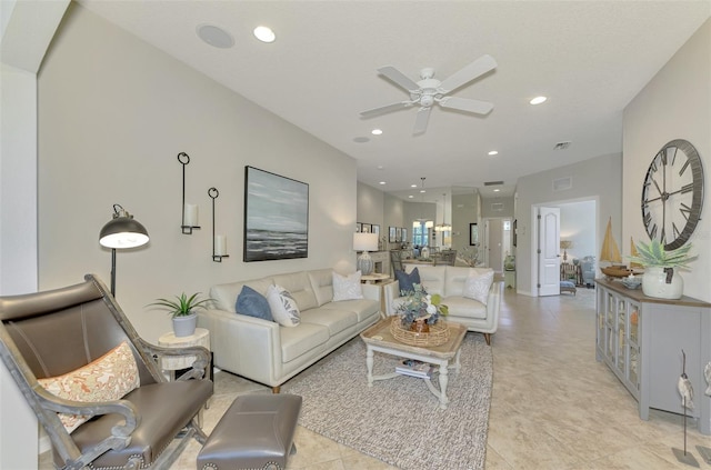 living room featuring a ceiling fan, recessed lighting, and visible vents