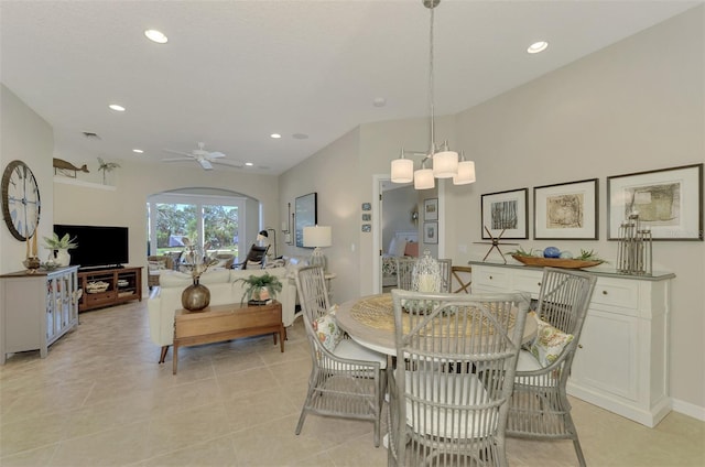 dining area featuring arched walkways, light tile patterned floors, a ceiling fan, and recessed lighting