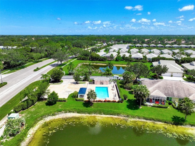 drone / aerial view with a water view and a residential view