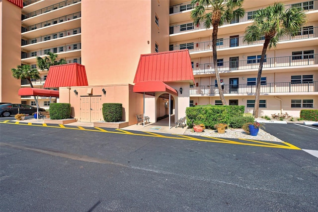 232 Saint Augustine Ave Unit 404, Venice, FL 34285 - view of apartment building / complex featuring uncovered parking