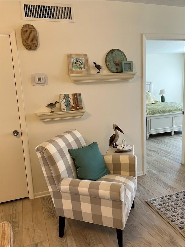 living area featuring hardwood / wood-style floors