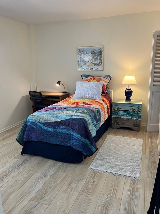 bedroom with light hardwood / wood-style floors