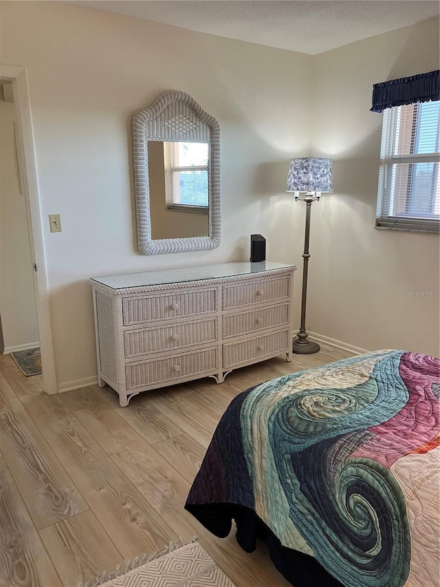 bedroom with light hardwood / wood-style floors