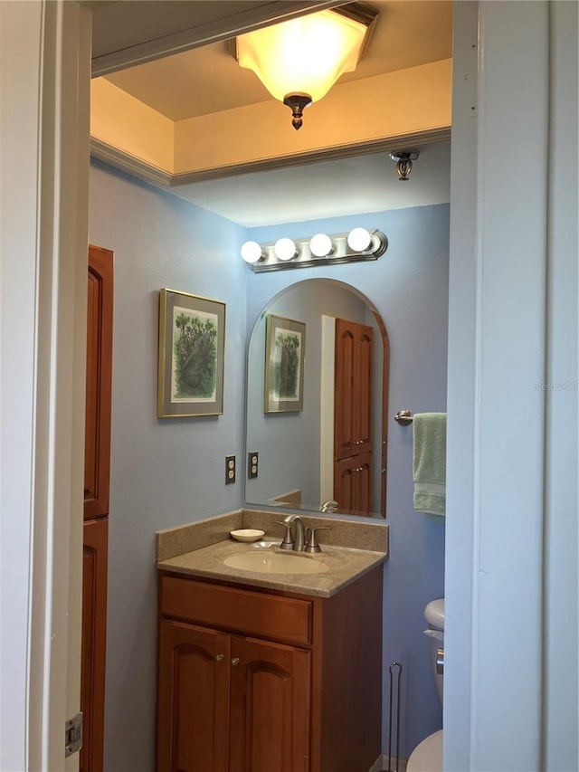 bathroom with vanity and toilet