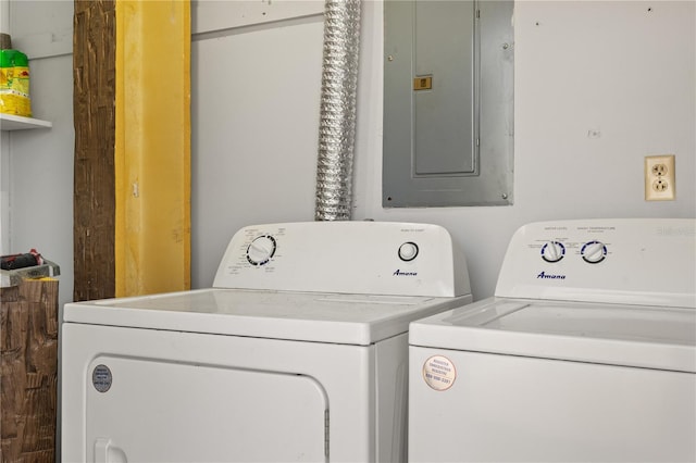 laundry area featuring electric panel and washer and dryer