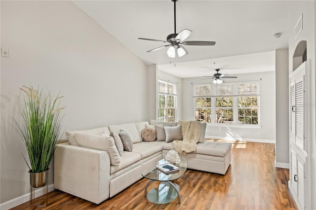 living room with vaulted ceiling, ceiling fan, and dark hardwood / wood-style floors