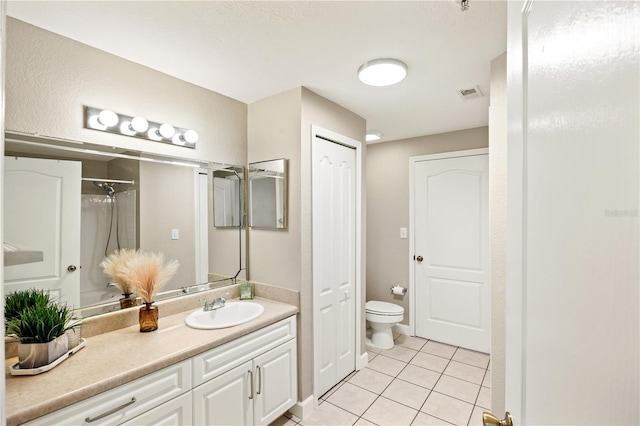 full bathroom with tile patterned floors, vanity,  shower combination, and toilet