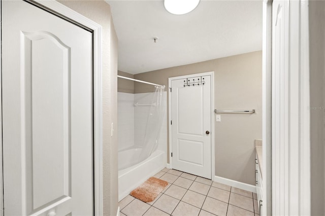 bathroom featuring vanity, tile patterned floors, and shower / bath combo with shower curtain