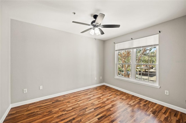 empty room with wood-type flooring and ceiling fan