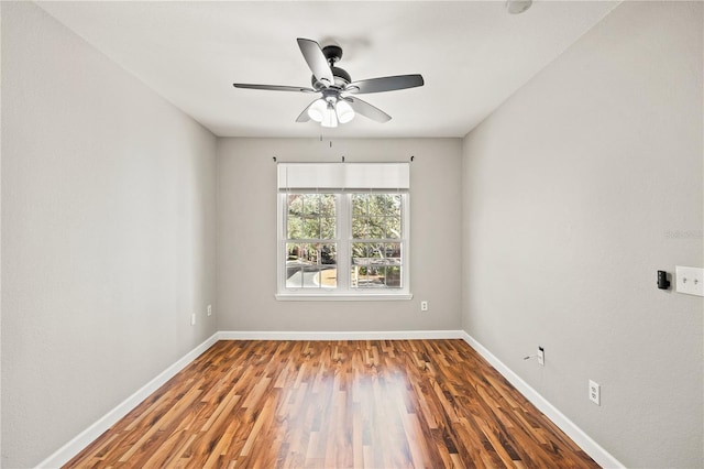 empty room with hardwood / wood-style flooring and ceiling fan