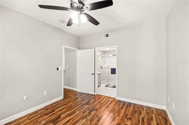 unfurnished room with ceiling fan and dark hardwood / wood-style floors