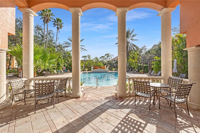 view of patio with a community pool