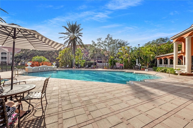 view of swimming pool with a patio