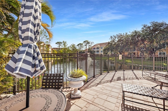 view of patio with a water view