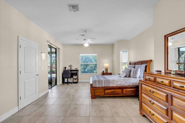 tiled bedroom featuring ceiling fan