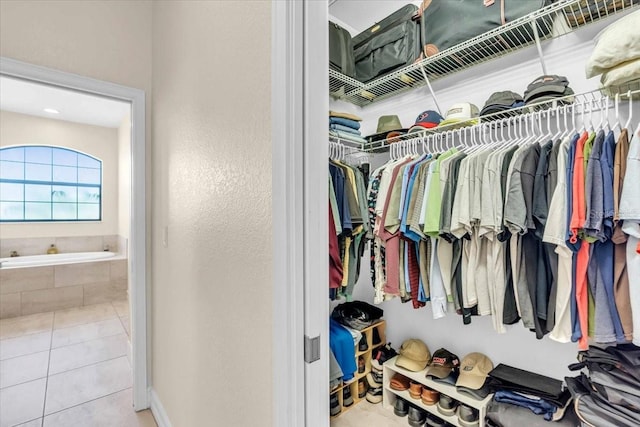 spacious closet featuring light tile patterned floors