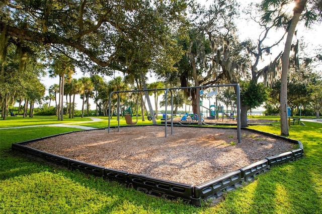 view of property's community featuring a playground and a yard