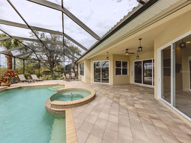 view of swimming pool featuring a lanai, a patio area, ceiling fan, and an in ground hot tub