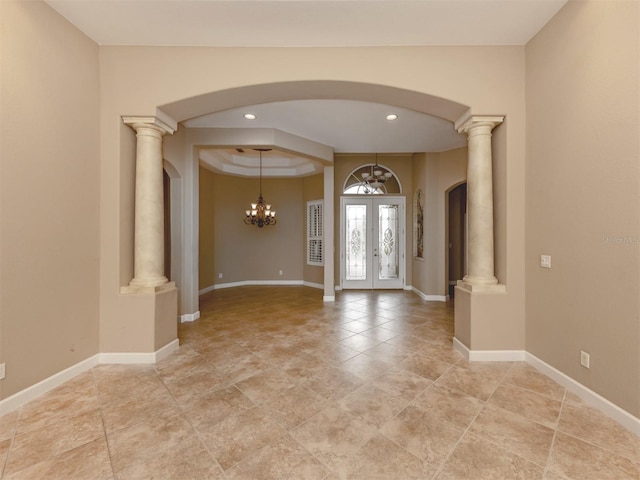 foyer entrance with french doors and decorative columns