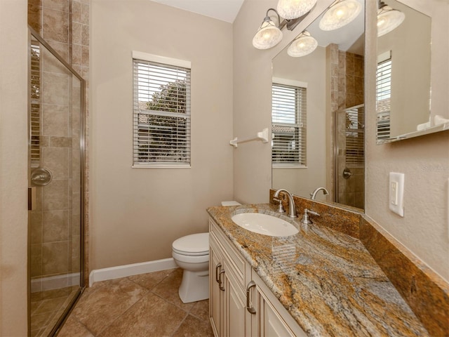 bathroom with vanity, toilet, an enclosed shower, and tile patterned flooring