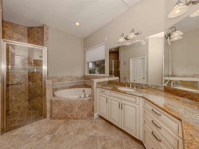 bathroom featuring vanity and shower with separate bathtub