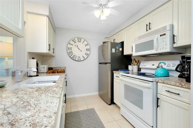 kitchen featuring white cabinetry, ceiling fan, sink, white appliances, and light tile patterned floors