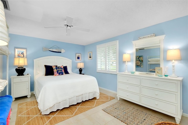 tiled bedroom featuring ceiling fan