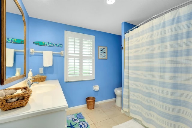 bathroom with tile patterned floors, vanity, and toilet