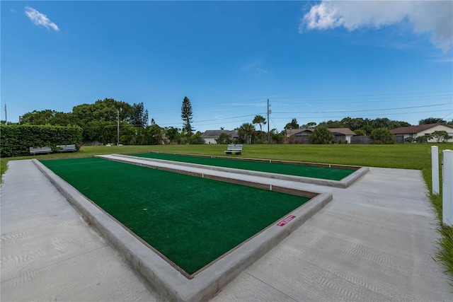 view of property's community featuring a yard