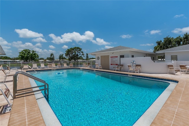 view of swimming pool featuring a patio area