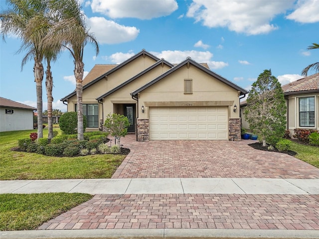 view of front of house with a garage and a front lawn