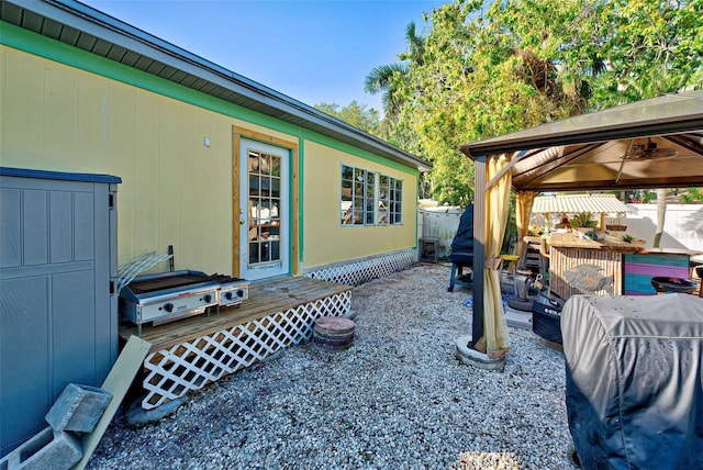 exterior space with a gazebo and a deck