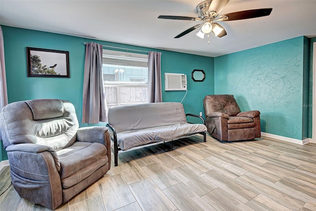 interior space featuring a wall mounted AC and ceiling fan