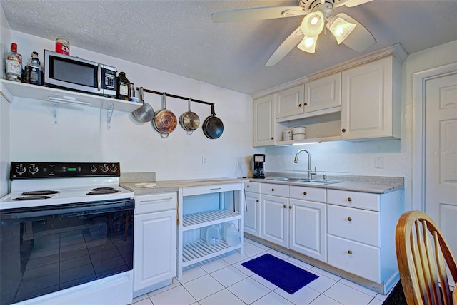 kitchen featuring a textured ceiling, ceiling fan, sink, light tile patterned floors, and white electric range