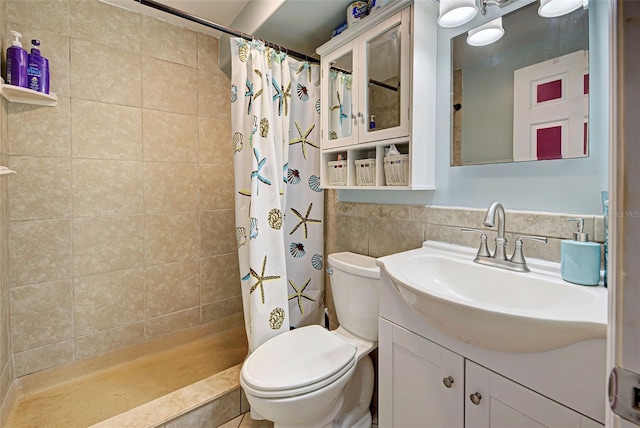 bathroom with toilet, vanity, and a shower with shower curtain