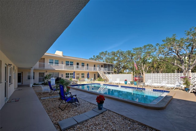 view of pool featuring a patio