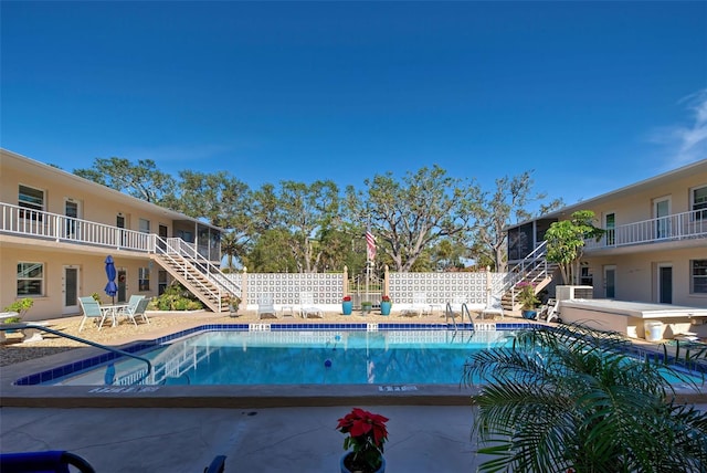 view of swimming pool featuring a patio area