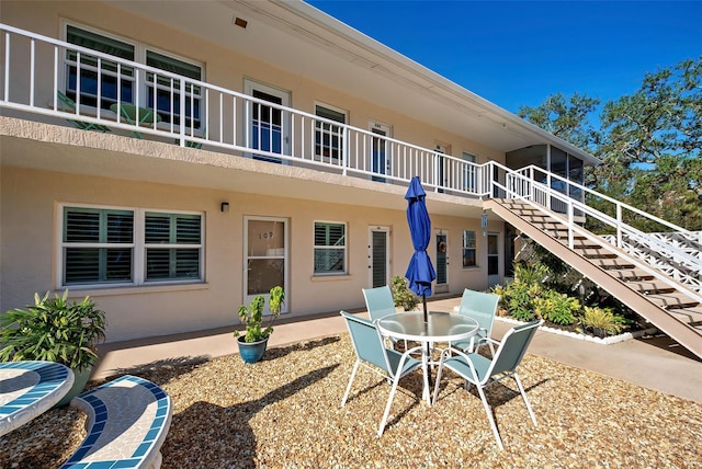 rear view of property featuring a patio area