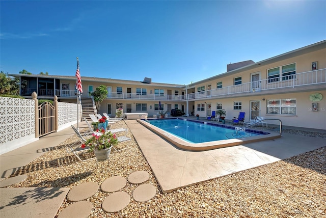 view of swimming pool featuring a patio area