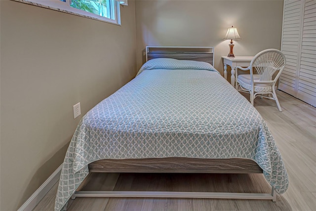 bedroom with hardwood / wood-style floors