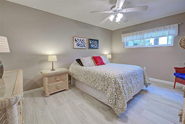 bedroom featuring ceiling fan and light hardwood / wood-style floors