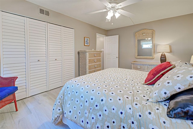 bedroom with ceiling fan and light hardwood / wood-style floors