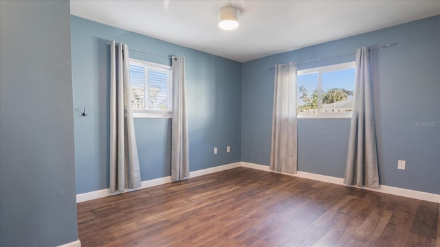 empty room featuring dark hardwood / wood-style floors