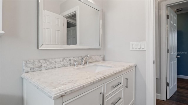 bathroom featuring hardwood / wood-style floors and vanity