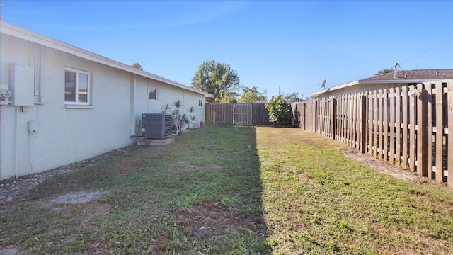 view of yard with central AC unit