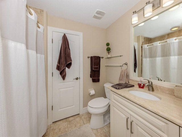 bathroom featuring toilet, vanity, tile patterned floors, and curtained shower