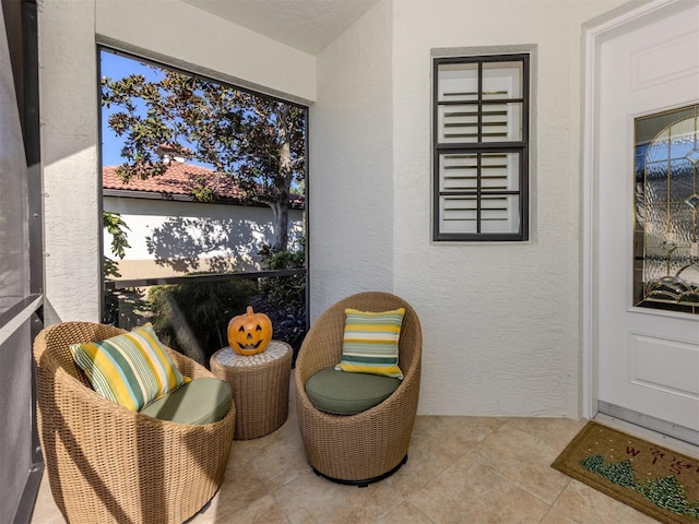 living area with light tile patterned floors